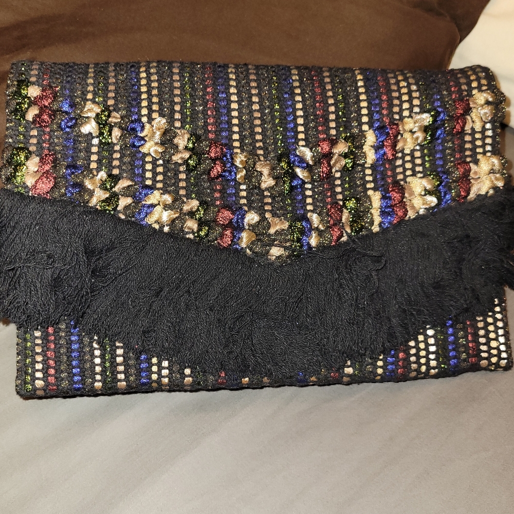 Stella and Dot clutch with fringe detail.